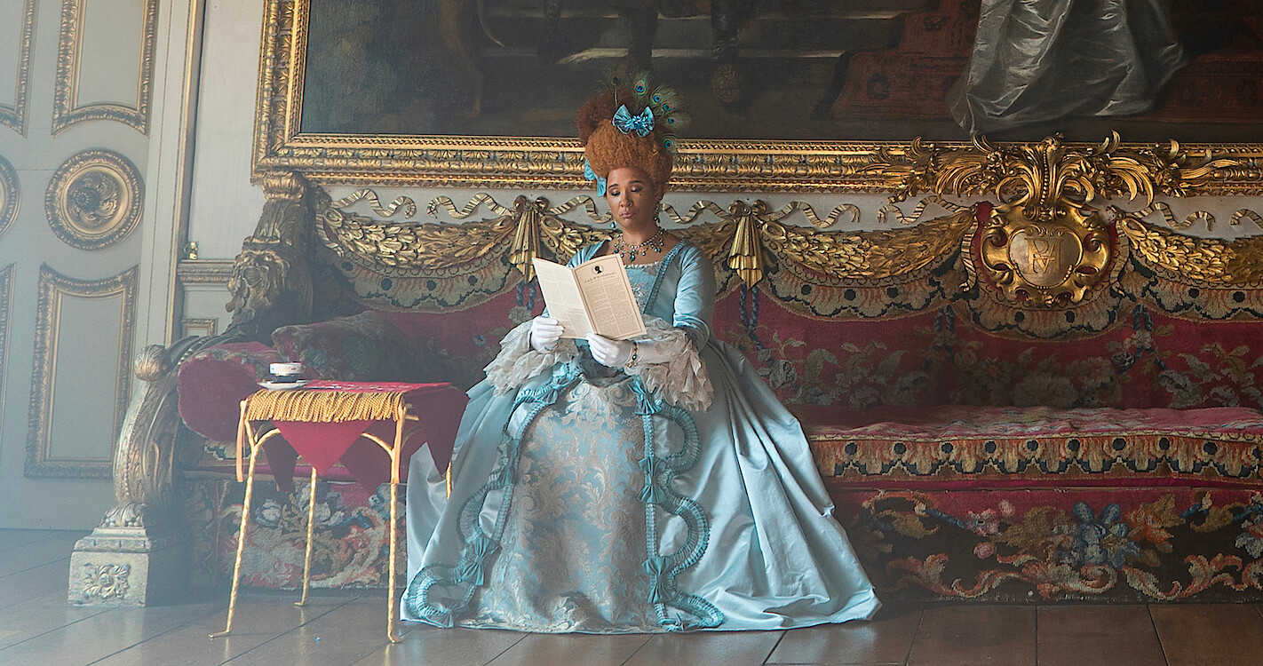 An image of Queen Charlotte reading the newsletter