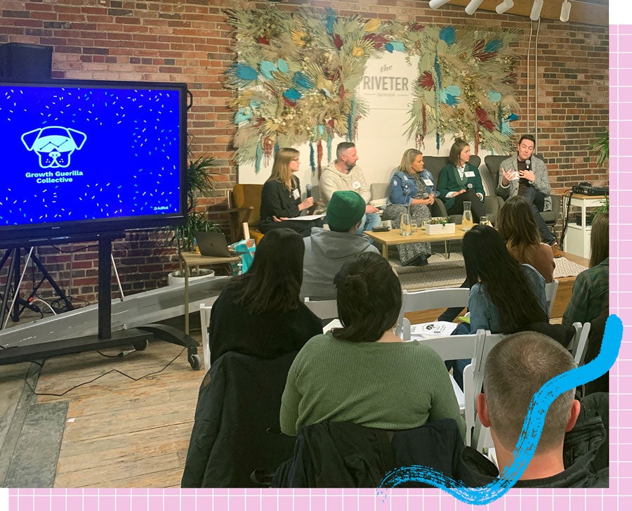 A panel of speakers presenting GGC slides.