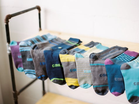 A row of different colorful and comfortable Cariloha socks. 