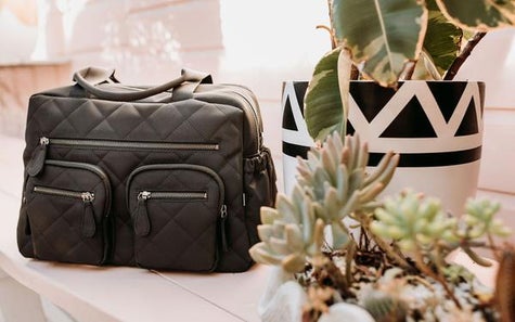 A fashionable black quilted nappy bag from OiOi. 