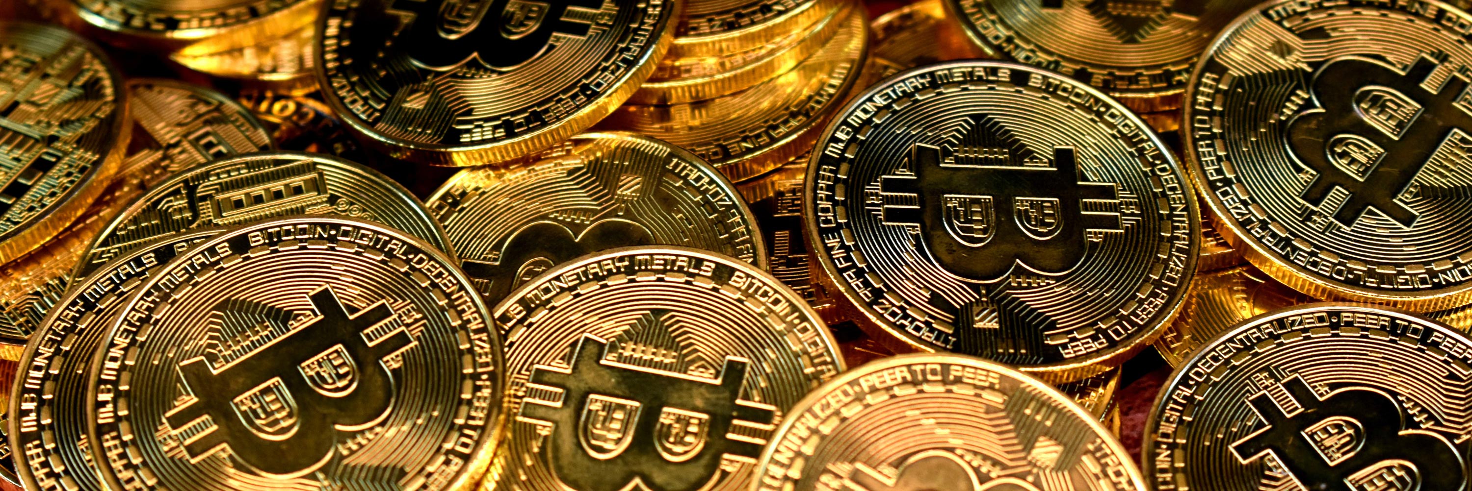 A pile of golden Bitcoins. 
